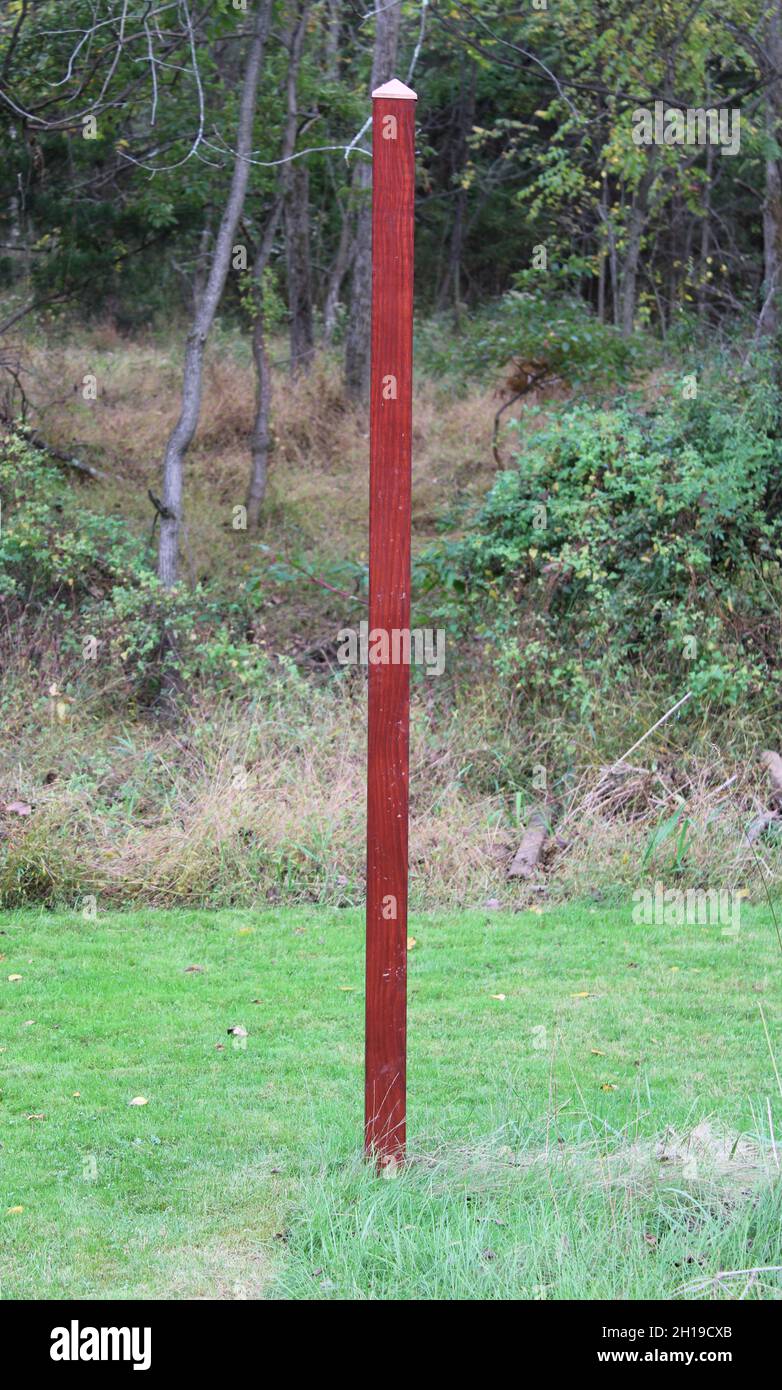 Un singolo montante in legno con tappo in rame Foto Stock