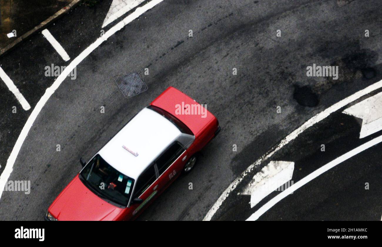 Taxi Red Toyota Comfort a Hong Kong. Foto Stock