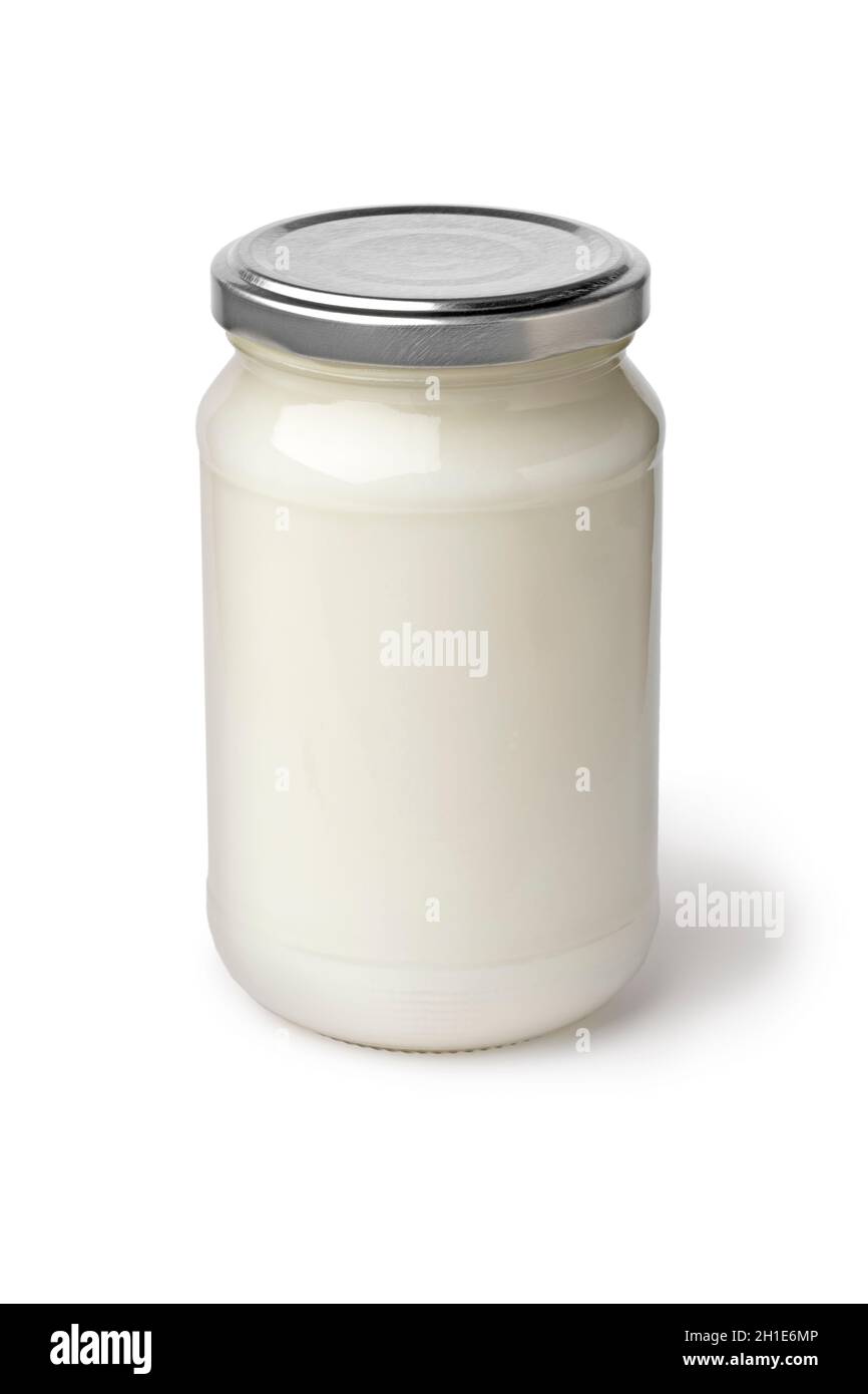 Vaso di vetro singolo con olio di cocco isolato su sfondo bianco Foto Stock