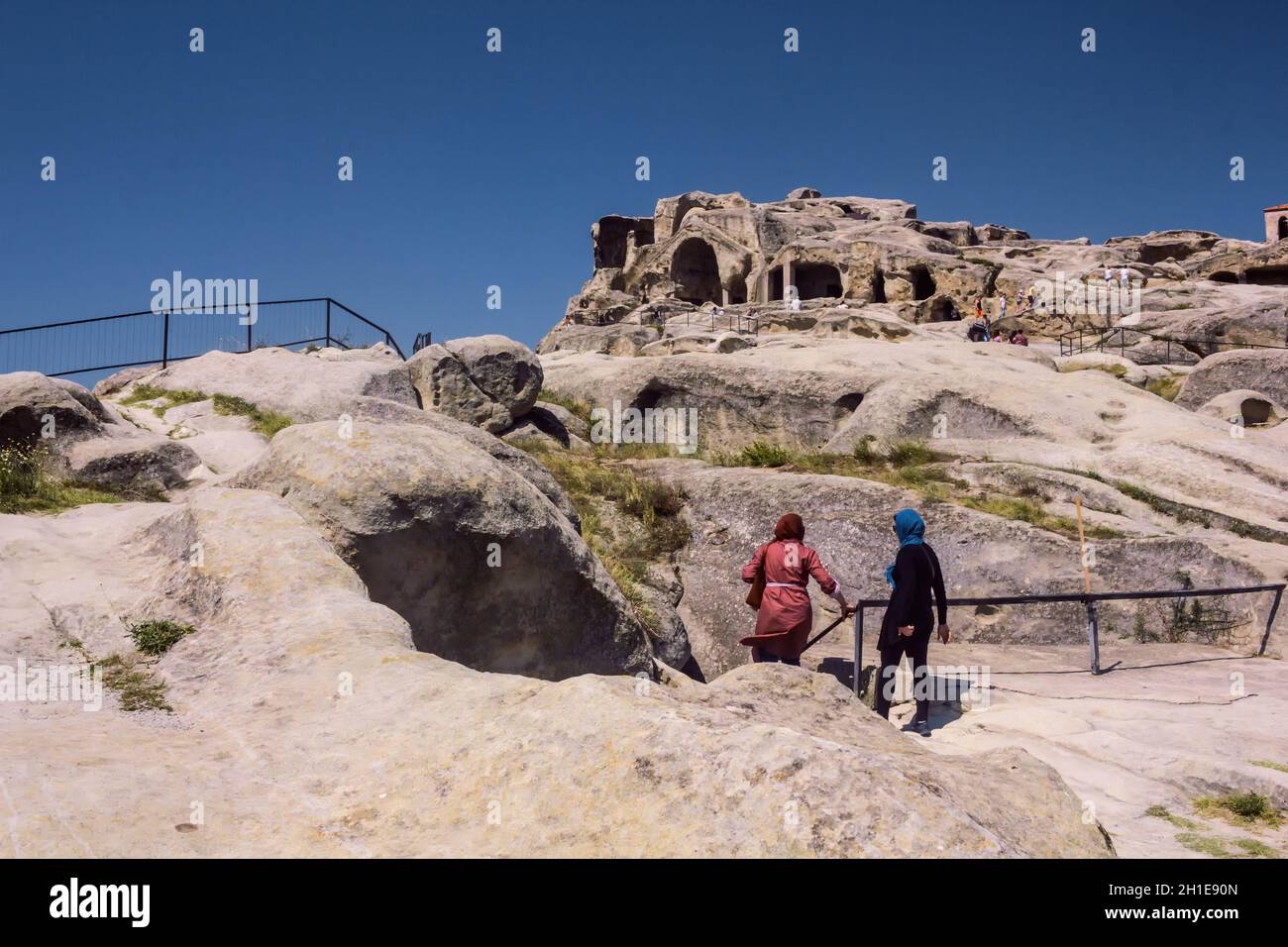 turistico musulmano Uplistsikhe - i più antichi insediamenti urbani in Georgia Foto Stock