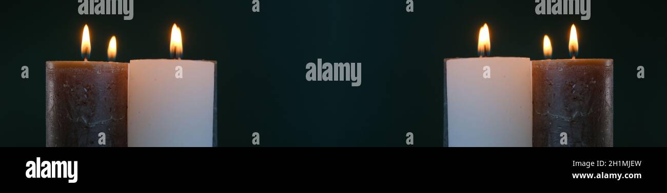 Candele banner.Candles che bruciano su sfondo scuro .Cere candele .sfondo religioso.sfondo religioso Foto Stock