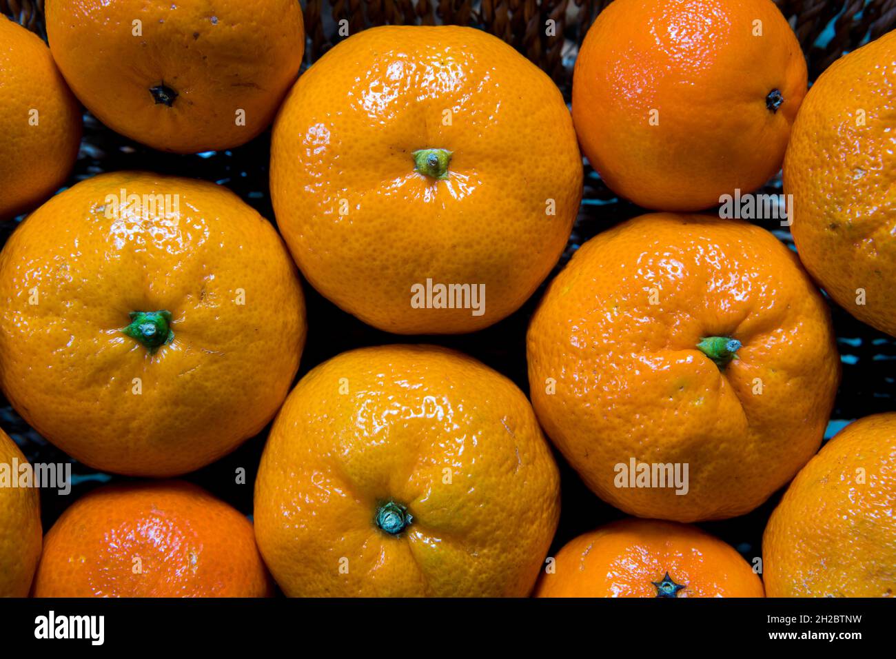 Sfondo mandarino arancione. Frutta fresca e matura per un'alimentazione sana Foto Stock