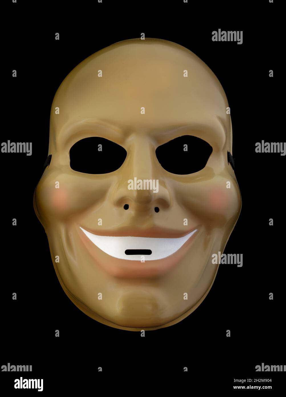 Maschera Smiler sinistra isolata contro sfondo nero Foto Stock