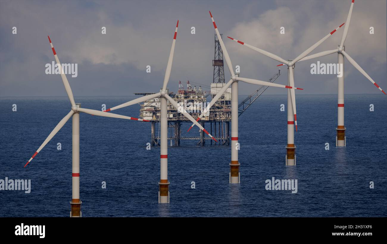 Parco eolico offshore a un bellissimo e spettacolare tramonto Foto Stock