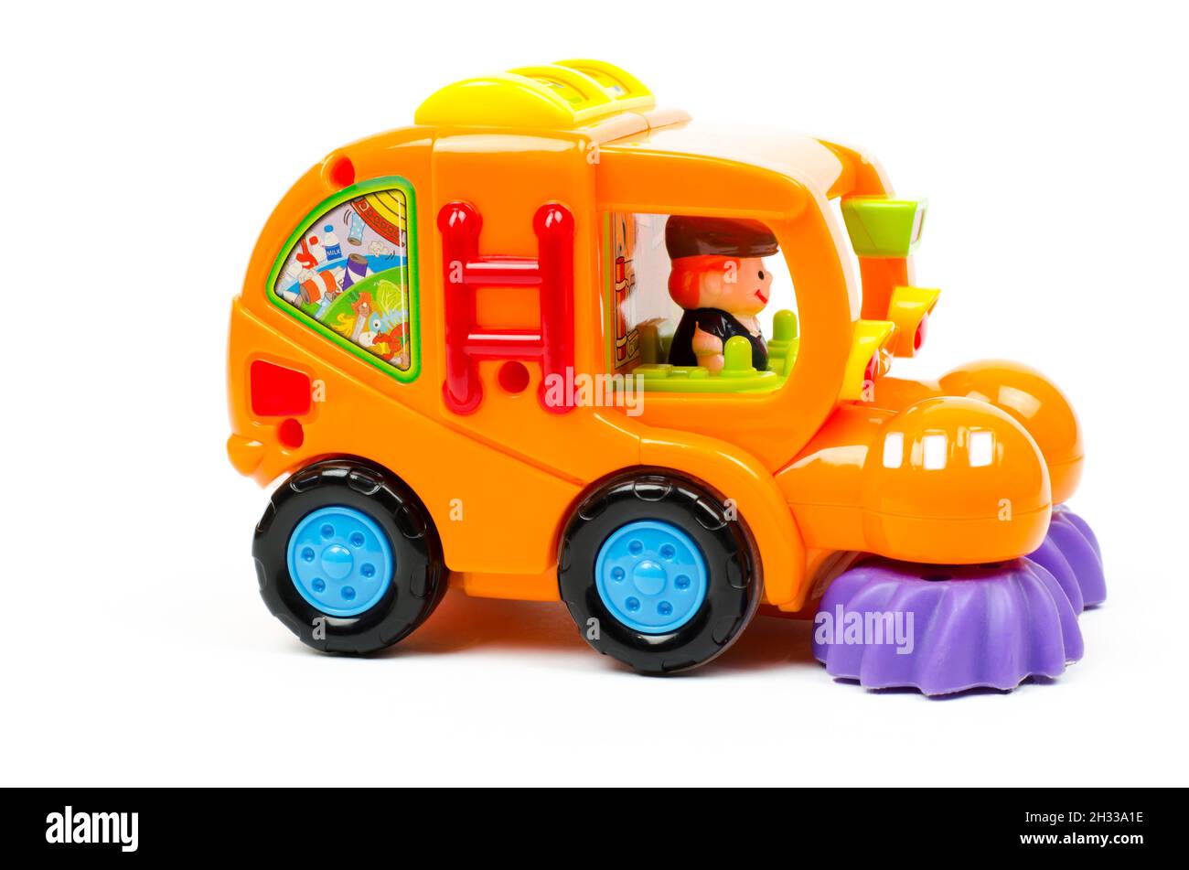 Detergente per auto giocattolo. Auto giocattolo per bambini in arancione. Foto Stock