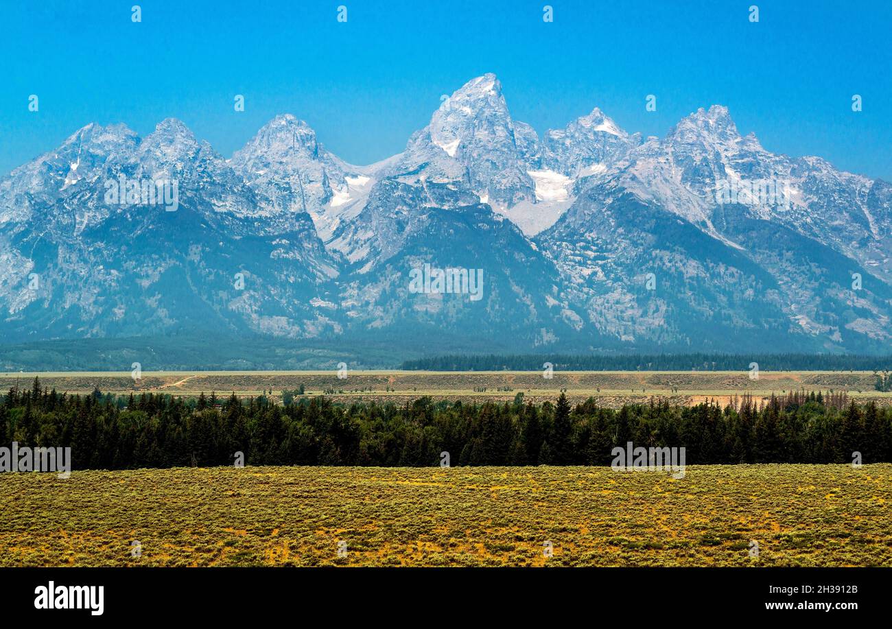 Fumo nocivo dagli incendi selvatici estivi sopra Teton Range, Grand Teton National Park, Wyoming Foto Stock