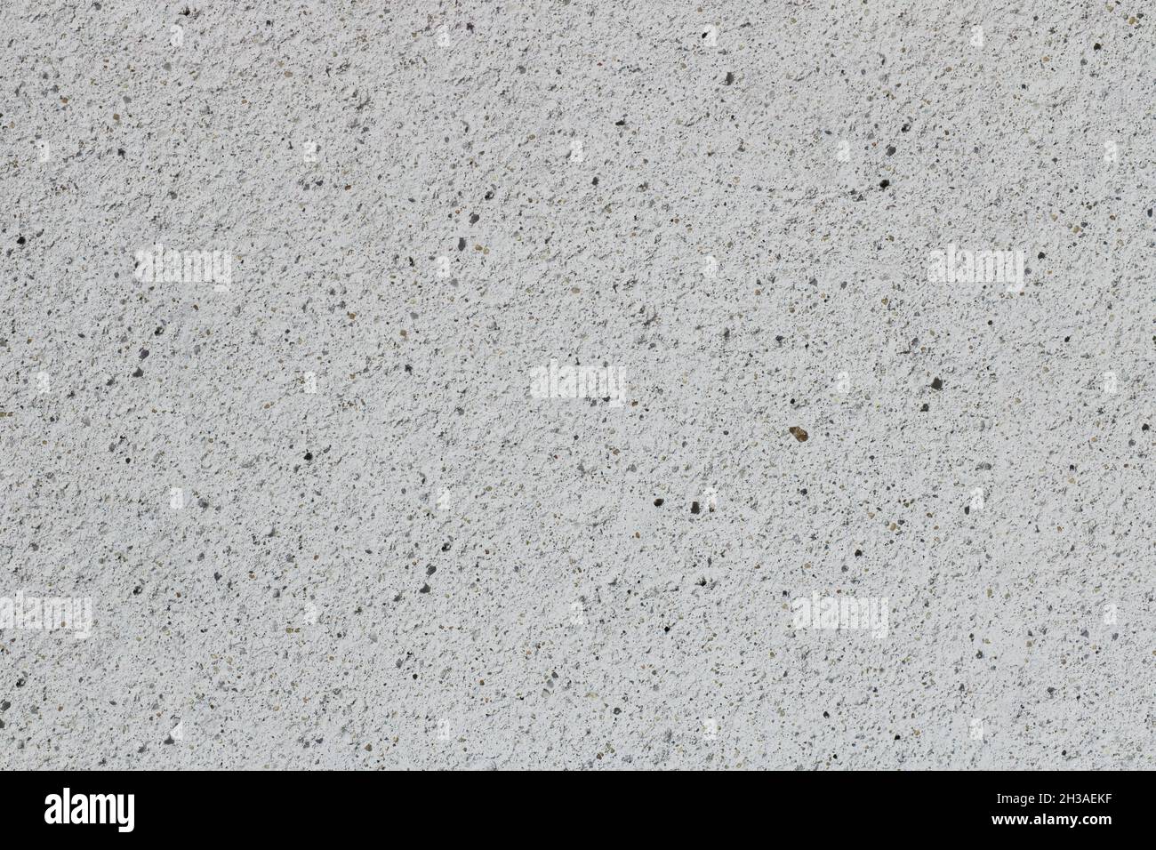 Fondo poroso in calcestruzzo grigio. Pavimento o muro di cemento vecchio.sfondo di calcestruzzo poroso grigio. Sfondo pietra per il testo. Pavimento in cemento o prodotto con Foto Stock