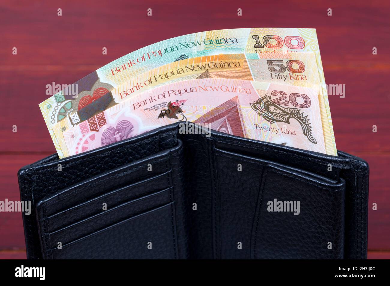 Papua nuovo Guinean denaro - kina nel portafoglio nero Foto Stock