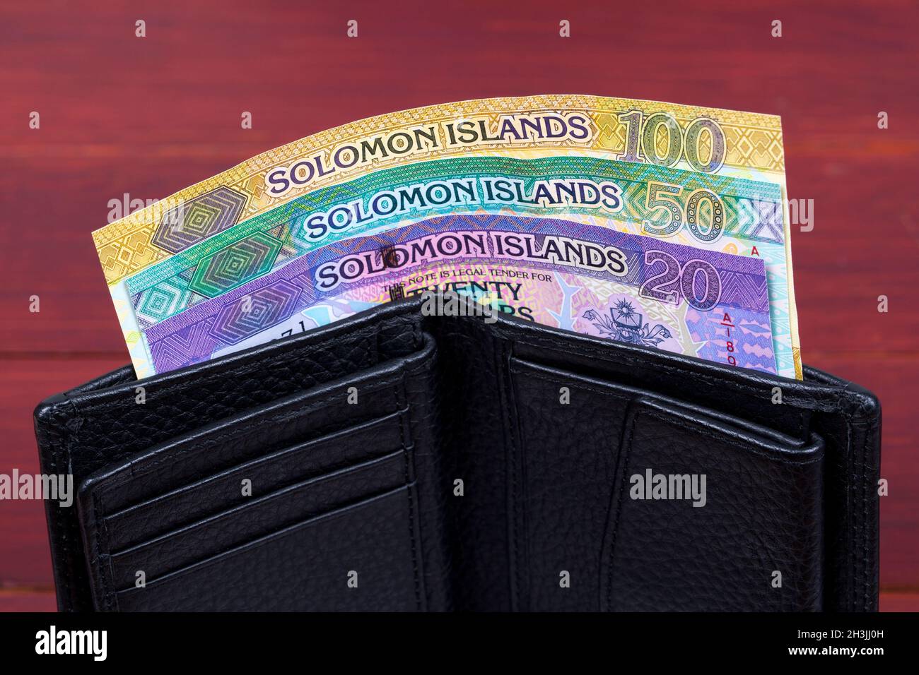 Solomon Islands money - dollaro nel portafoglio nero Foto Stock