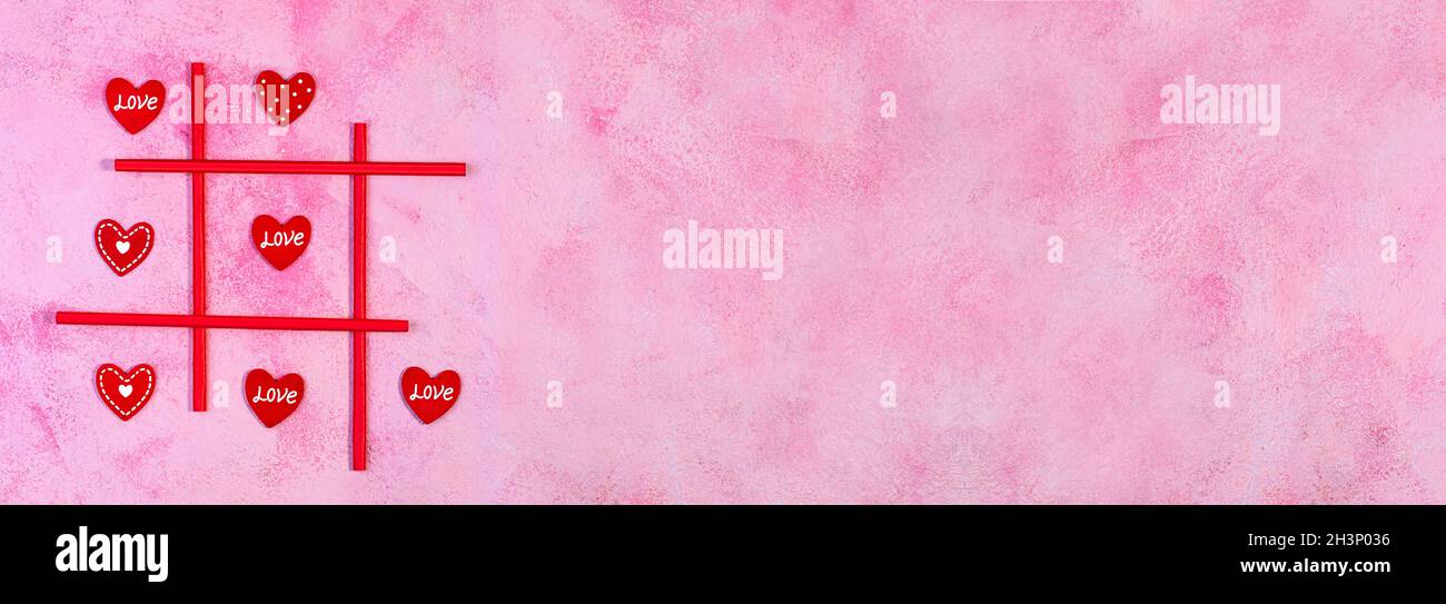 Concetto di giorno di San Valentino con il gioco X-o Hearts. Foto Stock