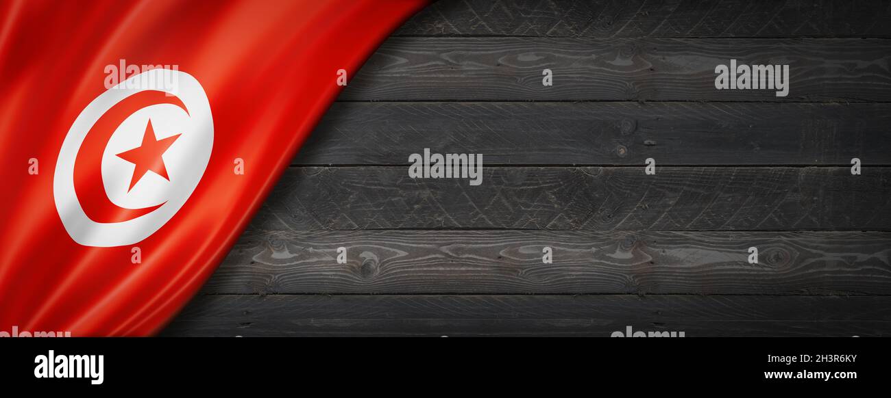 Bandiera tunisina su bandiera in legno nero Foto Stock