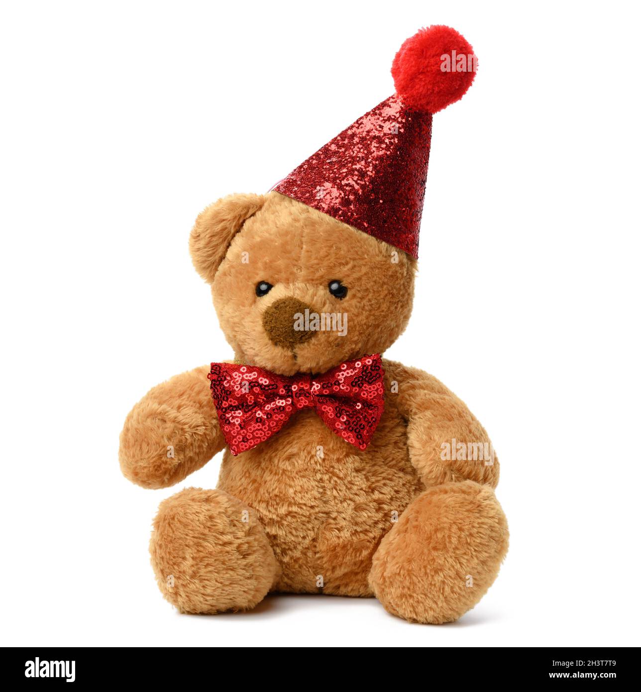Carino orsacchiotto marrone in un cappuccio rosso lucido festivo e una cravatta ad arco intorno al collo Foto Stock
