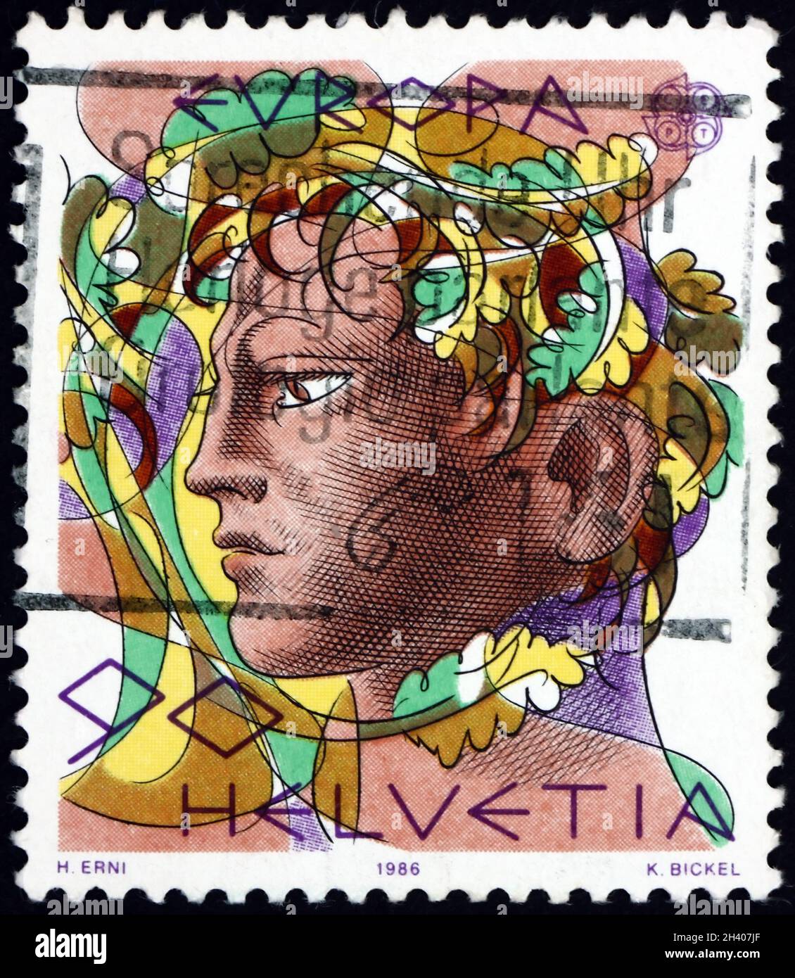 SVIZZERA - CIRCA 1986: Un francobollo stampato in Svizzera mostra la testa di un uomo, circa 1986 Foto Stock