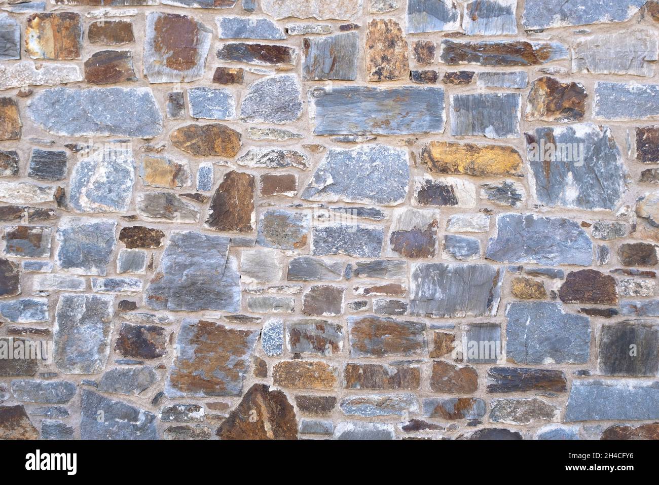 Texture Stonewall. Mattoni in pietra naturale. Foto Stock