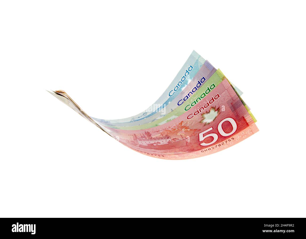 Vancouver, Canada: 23 marzo 2019: Le fatture del dollaro canadese presentate come volanti nell'aria, isolate su sfondo bianco Foto Stock