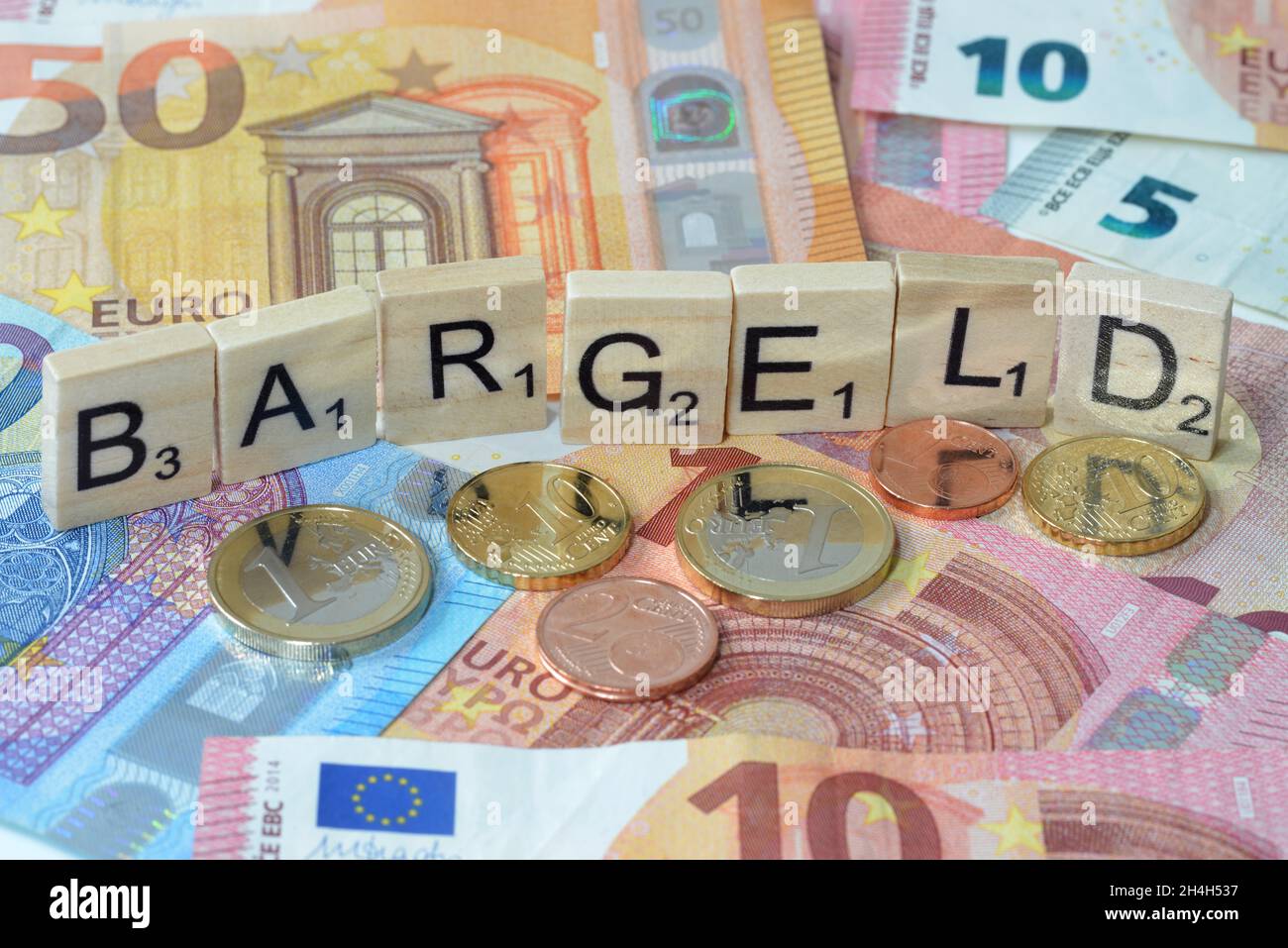 Foto simbolo termine economico contanti Foto Stock