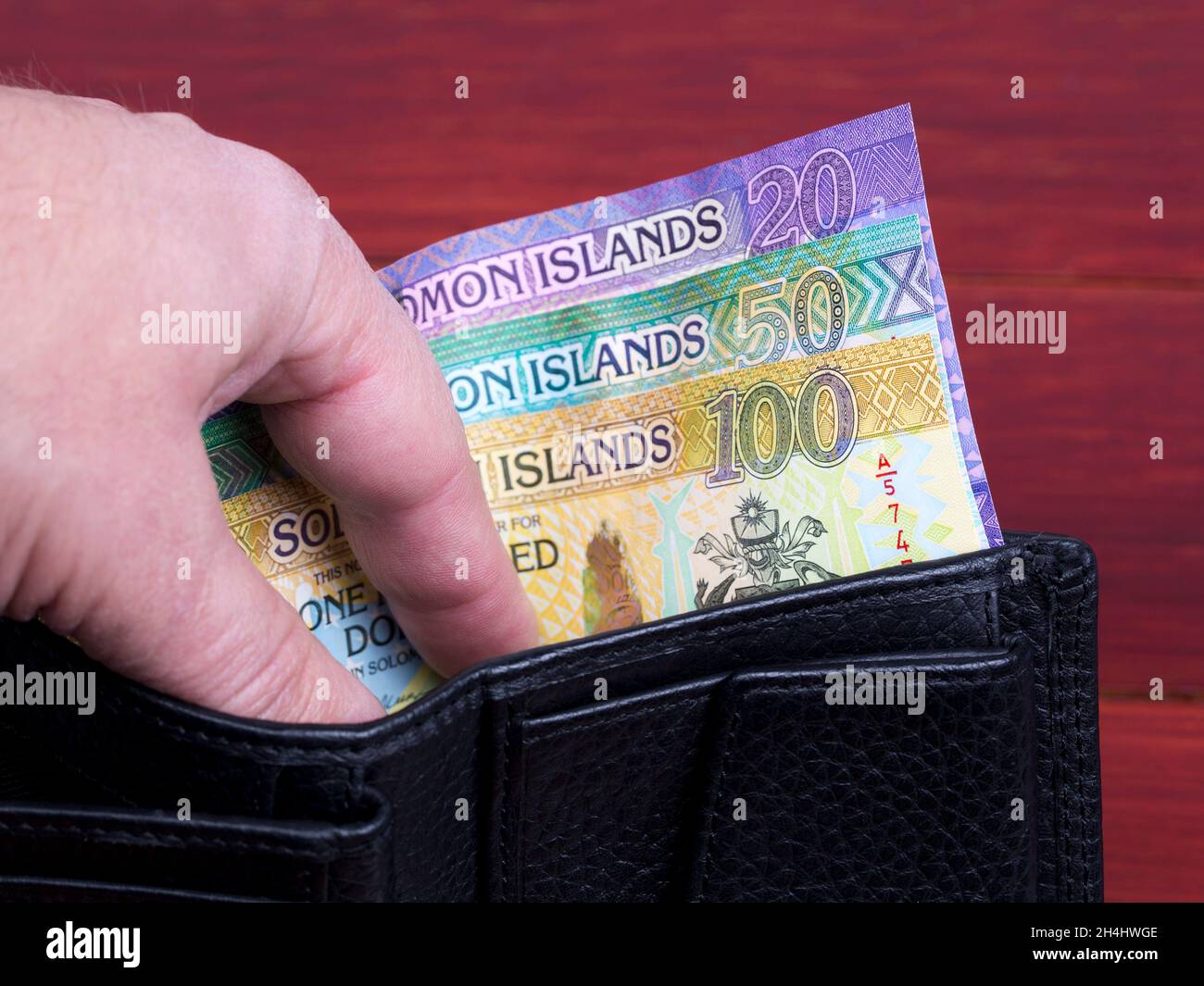 Solomon Islands money - dollaro nel portafoglio nero Foto Stock