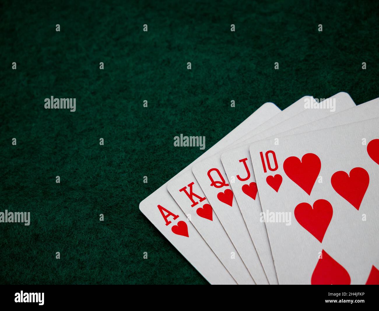 Carte da poker Royal Straight Flush su uno sfondo verde feltro tabella Foto Stock