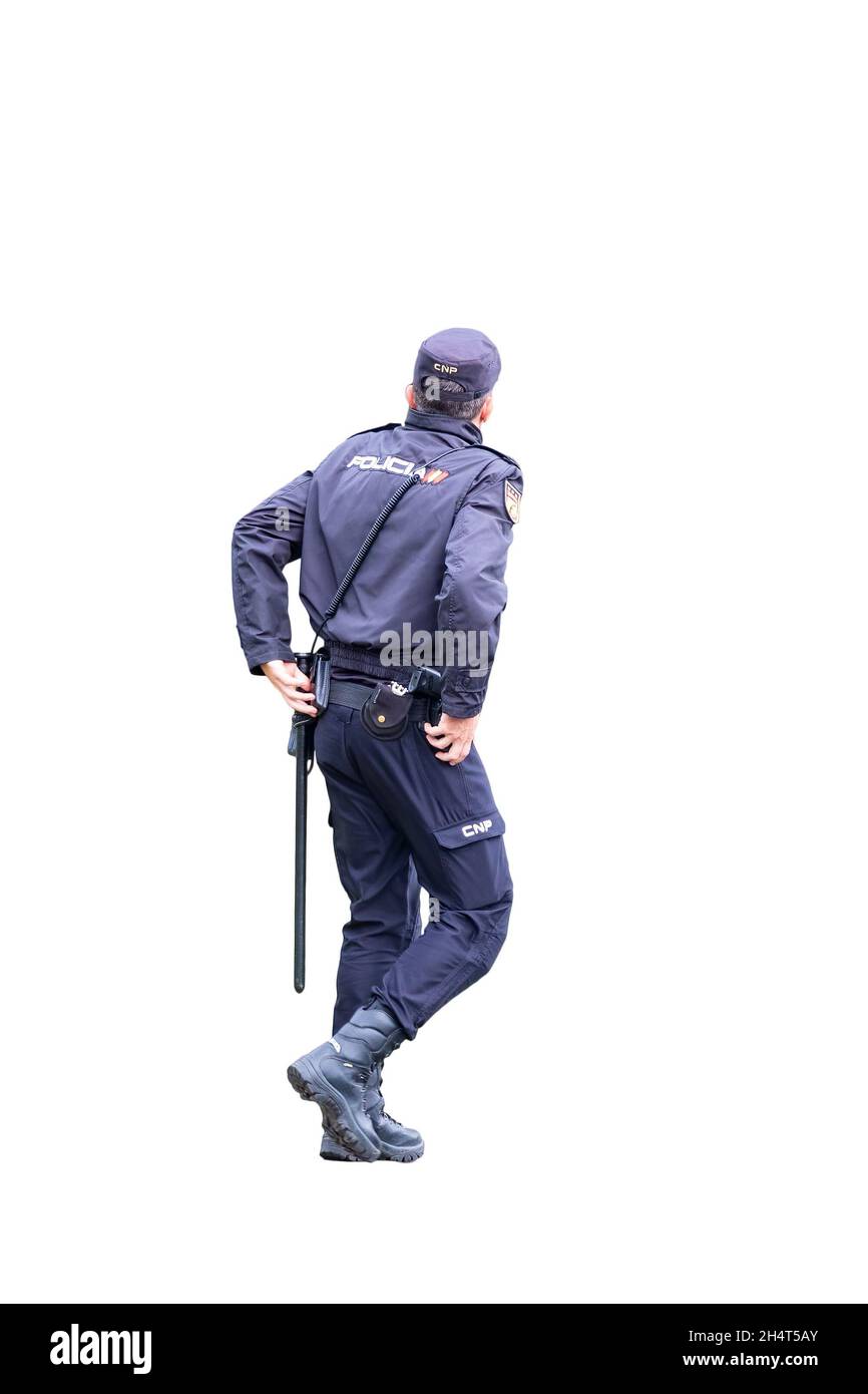 Vista posteriore della polizia nazionale spagnola con emblema con logo 'Policia' su uniforme isolato su sfondo bianco Foto Stock