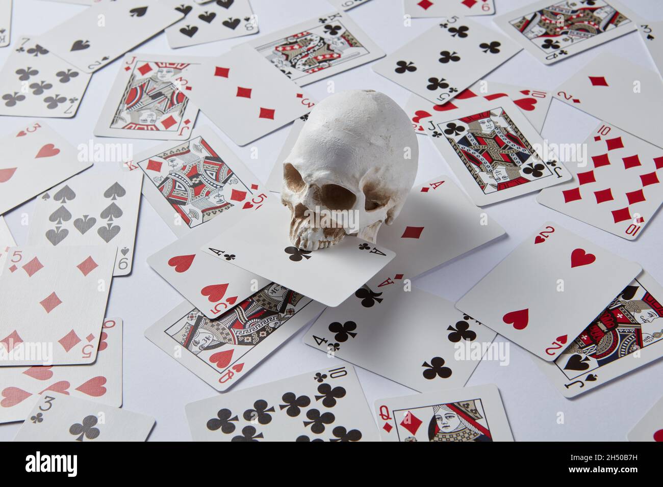 Cranio con asso di club Foto Stock