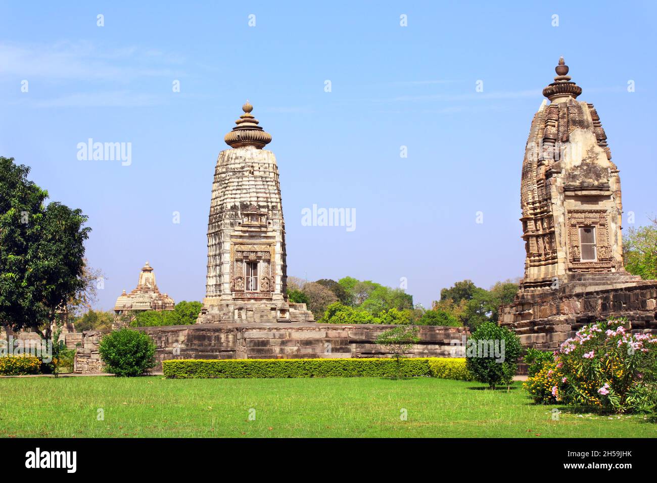 Antichi templi in pietra a Khajuraho, Madya Pradesh, India. Sito patrimonio dell'umanità dell'UNESCO Foto Stock