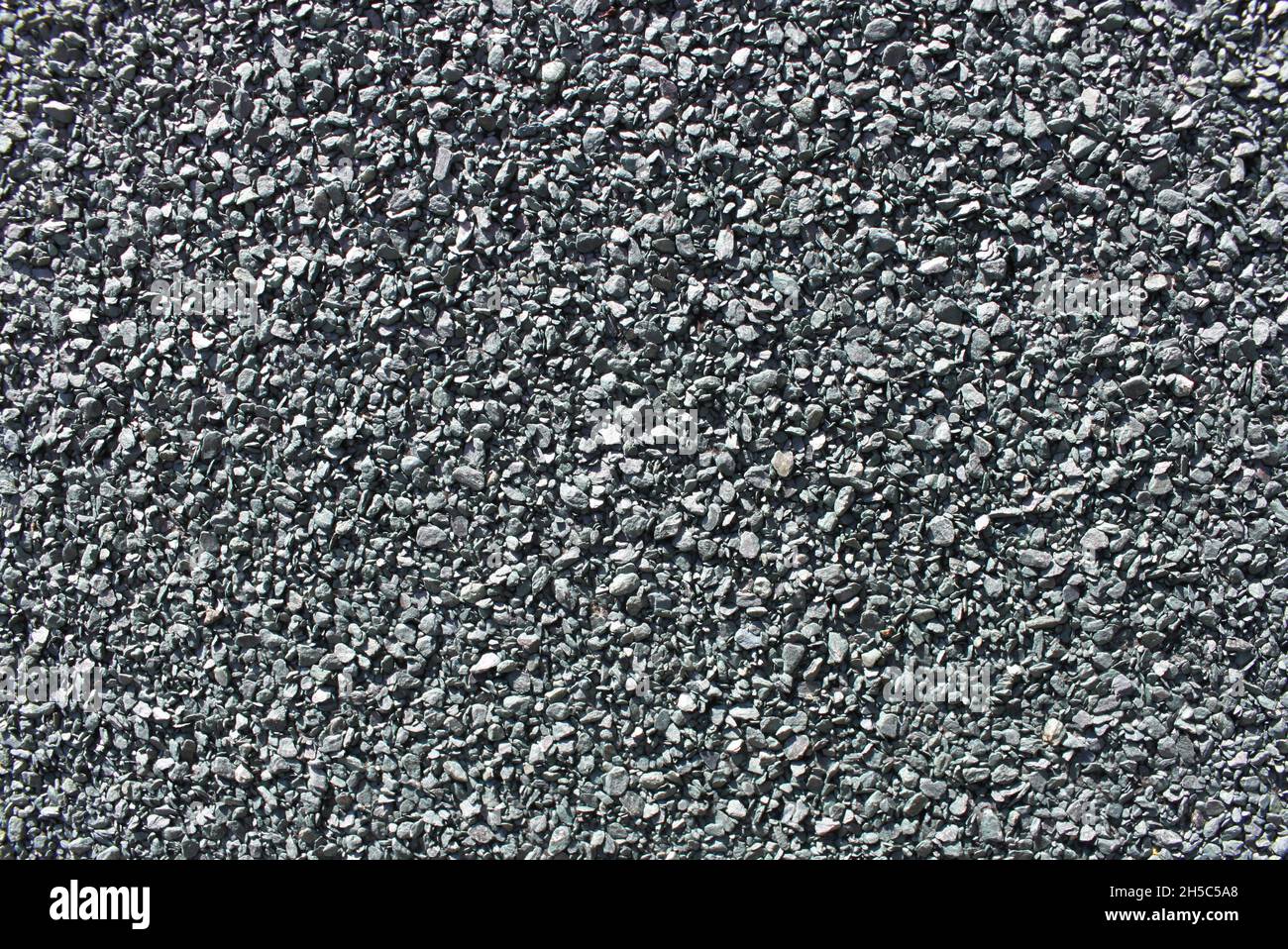 primo piano di una superficie ruvida di pietra blu grigiastra Foto Stock