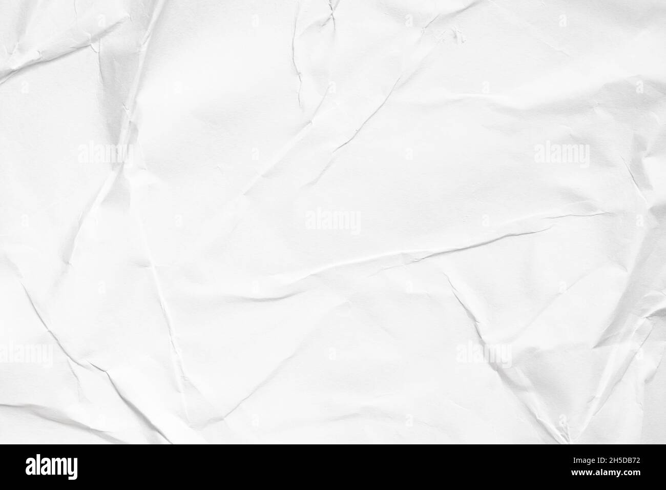 Carta bianca grattugiata con fondo luminoso ad alta intensità Foto Stock