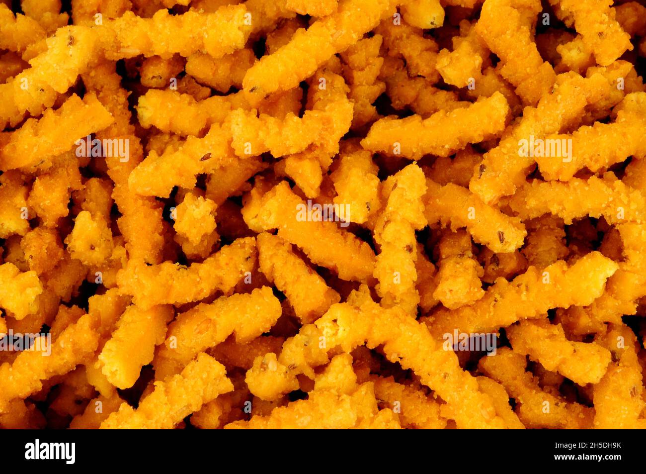 Chakri indiano saporito piccante riso croccante fondo snack bastone Foto Stock