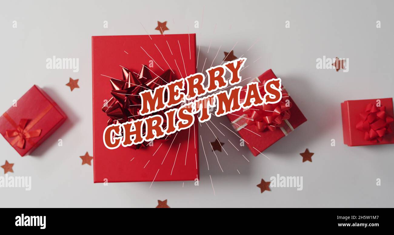 Immagine di buon testo di natale sopra i regali Foto Stock