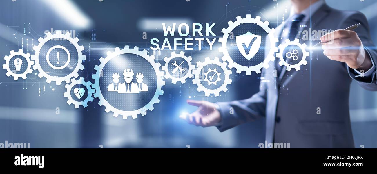 Sicurezza sul lavoro la normativa HSE regola il concetto di business sullo schermo. Foto Stock