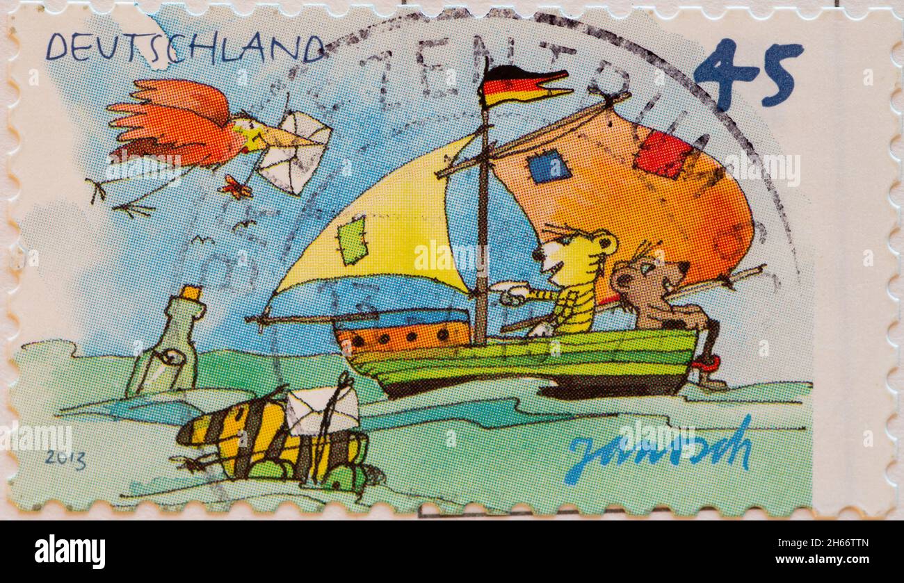 GERMANIA - CIRCA 2013 : un francobollo dalla Germania, che mostra un francobollo per i bambini una barca a vela da Janosch Foto Stock