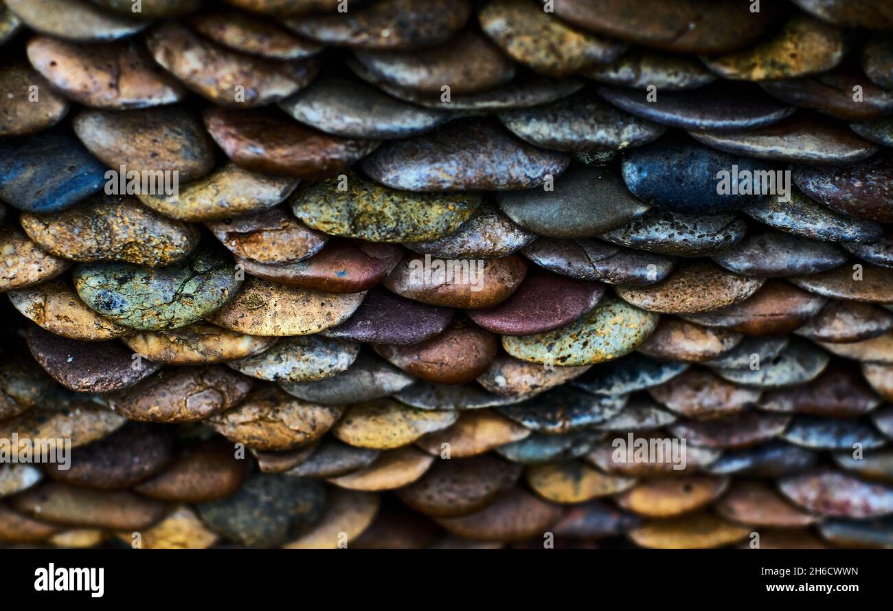 Sfondo di ciottoli sul muro Foto Stock