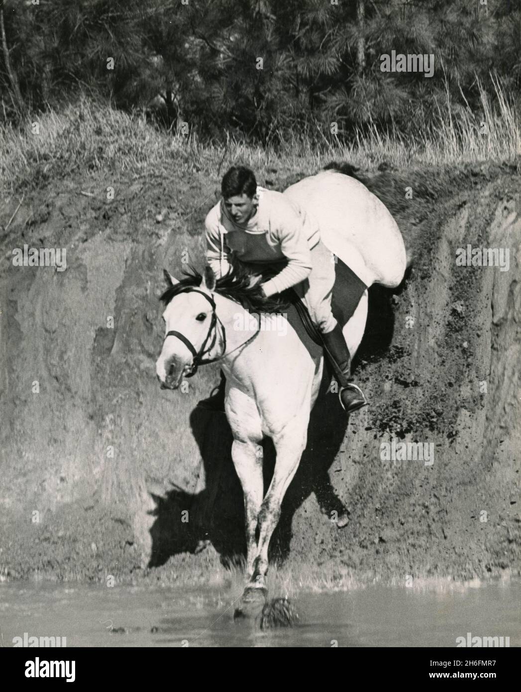 L'atleta equestre americano John 'Jeb' Wofford guida il suo cavallo Butch a Camden, South Carolina, USA 1952 Foto Stock