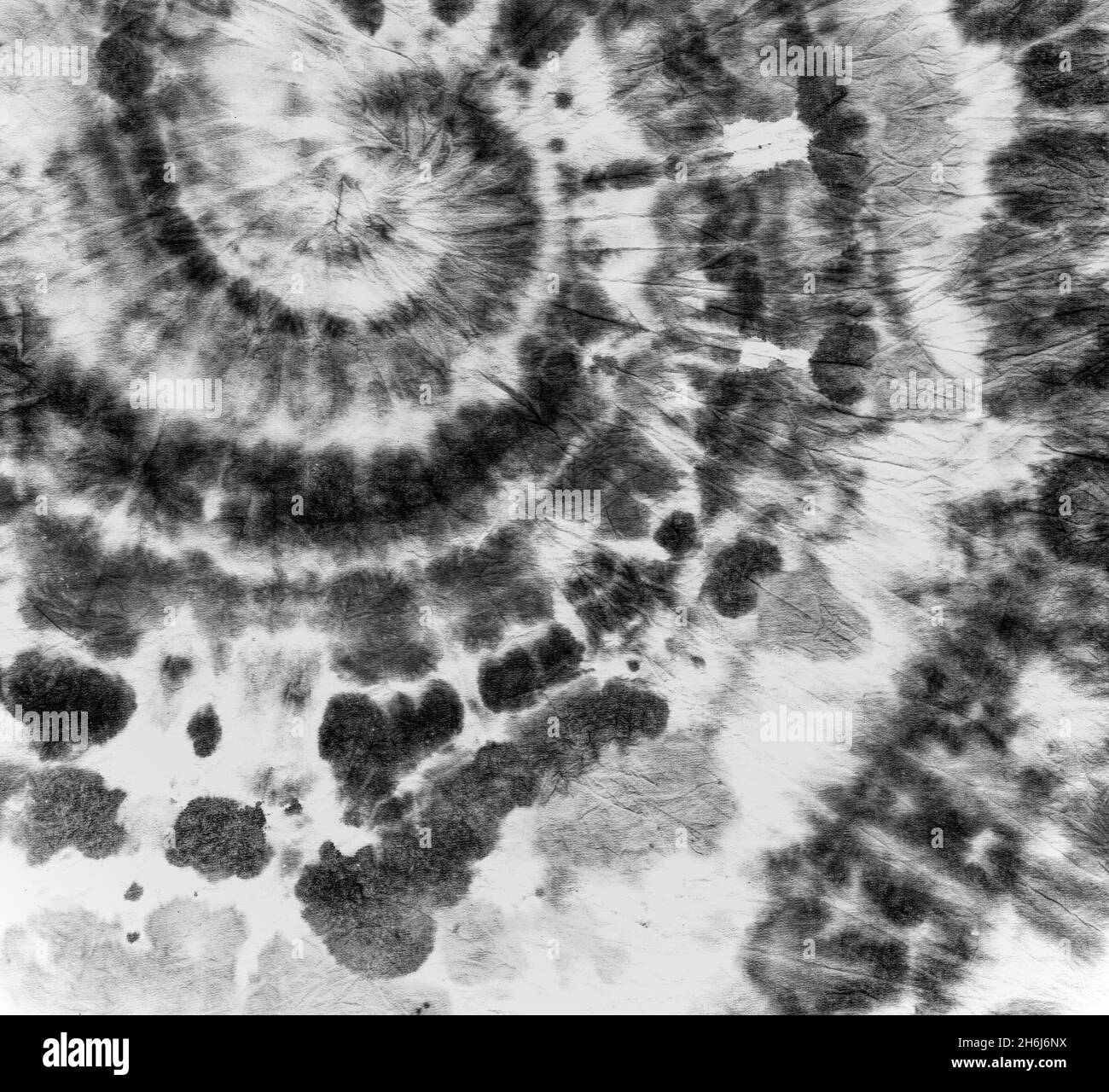 Tessuto tie-dye. Camicia artistica nera. Hippie sfondo psichedelico. Texture circolare tie-dye. Vernice a inchiostro batik. Grunge spirali modelli. Riassunto Cool De Foto Stock