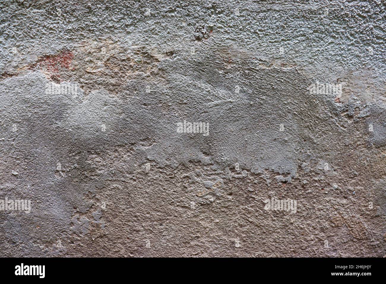 Muro di cemento vecchio e ruvido, sfondo testurizzato, strati di cemento. Foto Stock