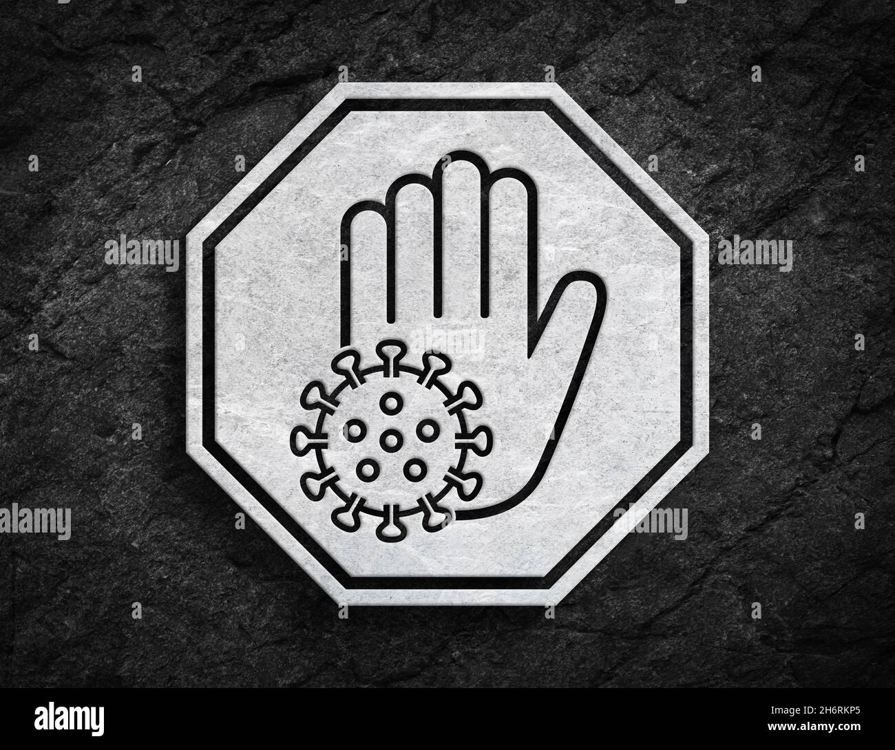 Bianco stop covid virus corona infezione mano palmo segno su sfondo pietra scuro Foto Stock
