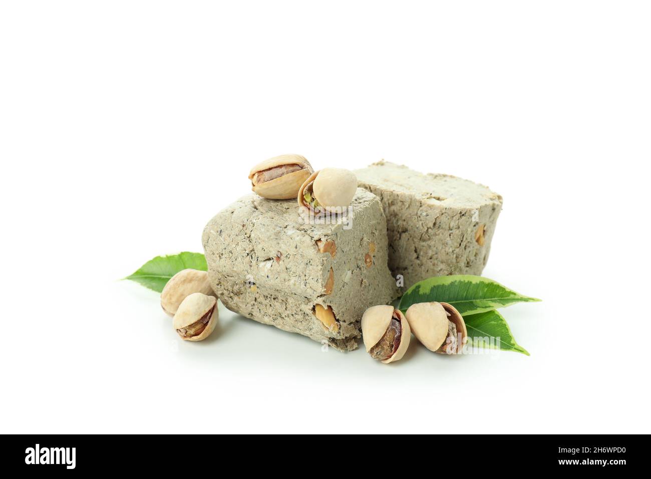 Halva con noci isolate su sfondo bianco Foto Stock