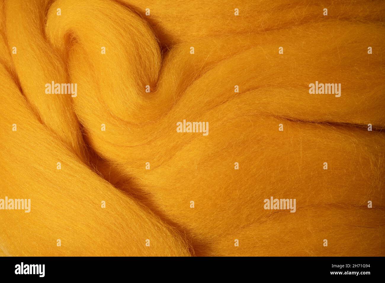 Lana texture closeup. Texture dettagliata con lana gialla naturale Foto Stock