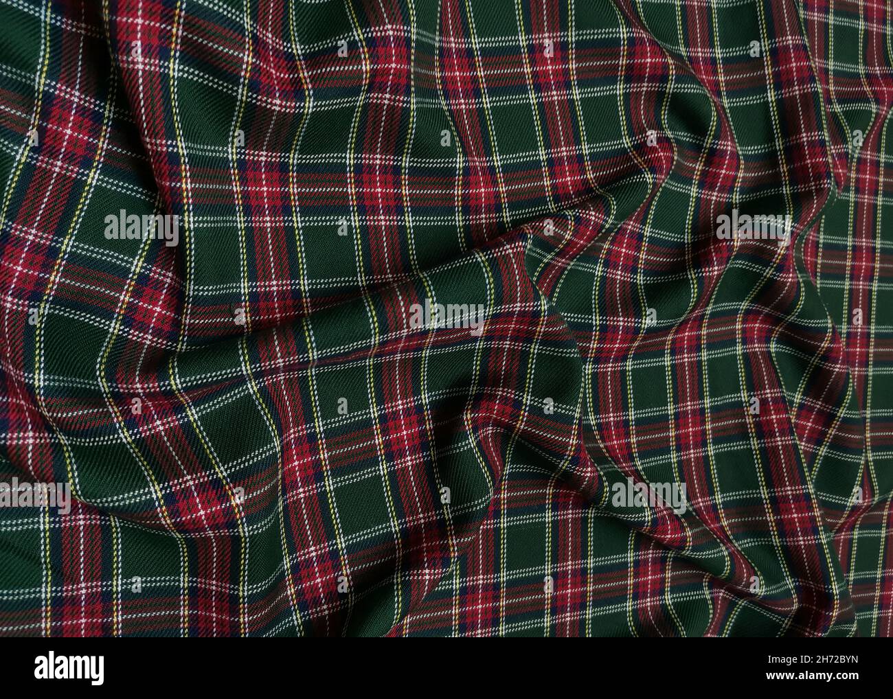 Tessuto uniforme scuola di lana in tartan verde. Classico scozzese in flanella senza cuciture. Modello onda tradizionale per uno sfondo di Natale o. Foto Stock