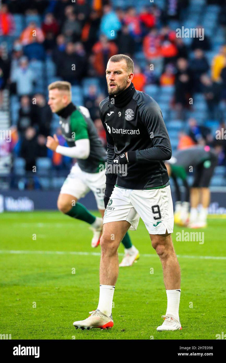 CHRISTIAN DOIDGE, calciatore professionista, giocando per l'Hibernian FC, riscaldando prima di una partita contro il Rangers FC, Glasgow, Scozia, Regno Unito Foto Stock