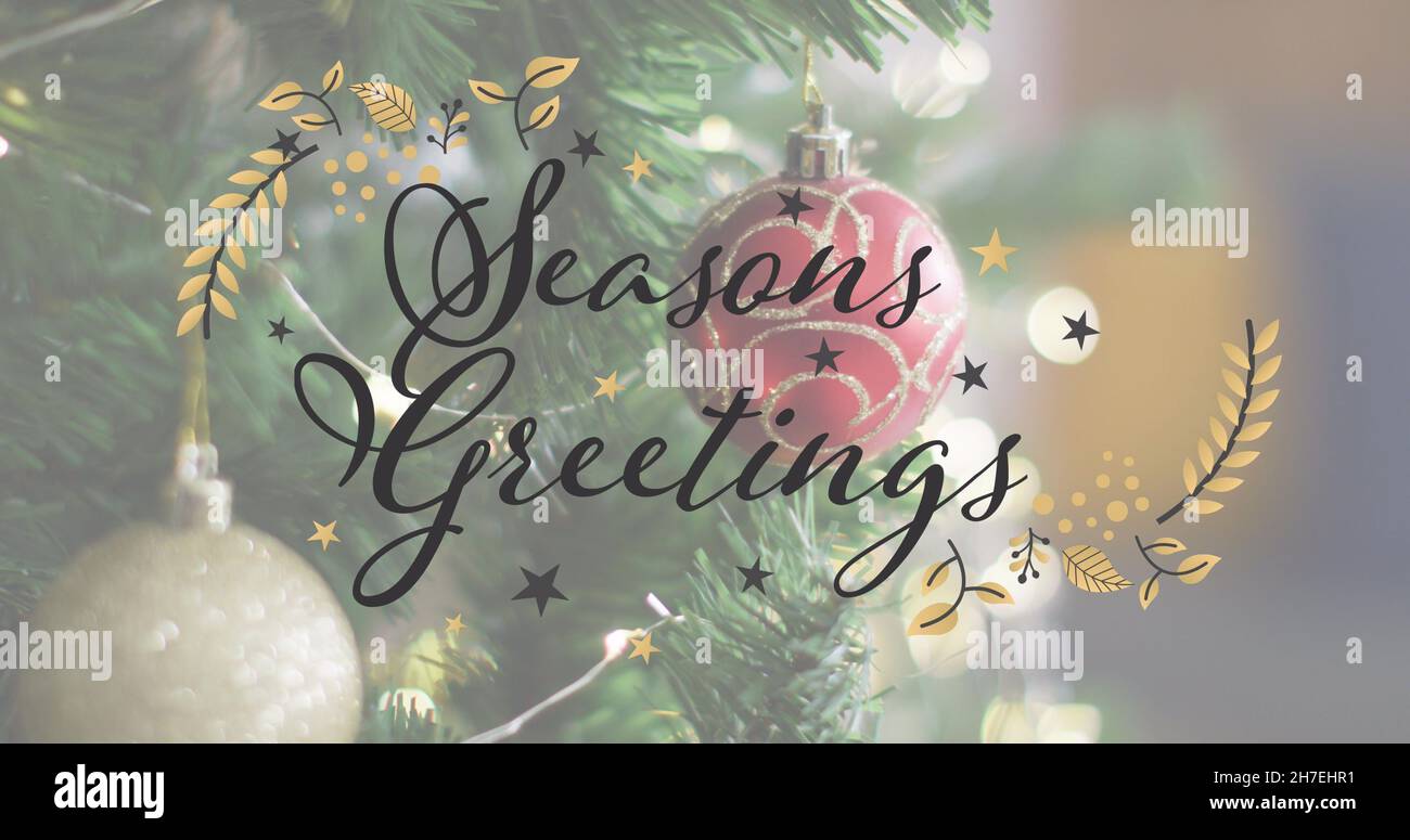 Immagine del testo di auguri di stagioni sopra l'albero di natale Foto Stock