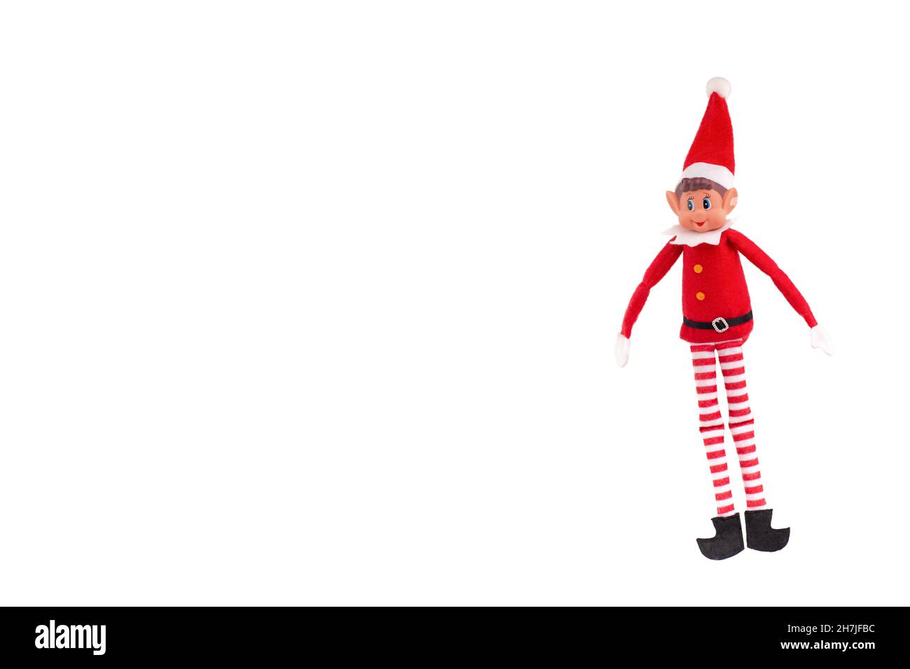 Giocattolo Elf di Natale su sfondo bianco isolato con spazio per la copia. Lo spirito di Natale, la tradizione della mensola di Natale. Foto Stock