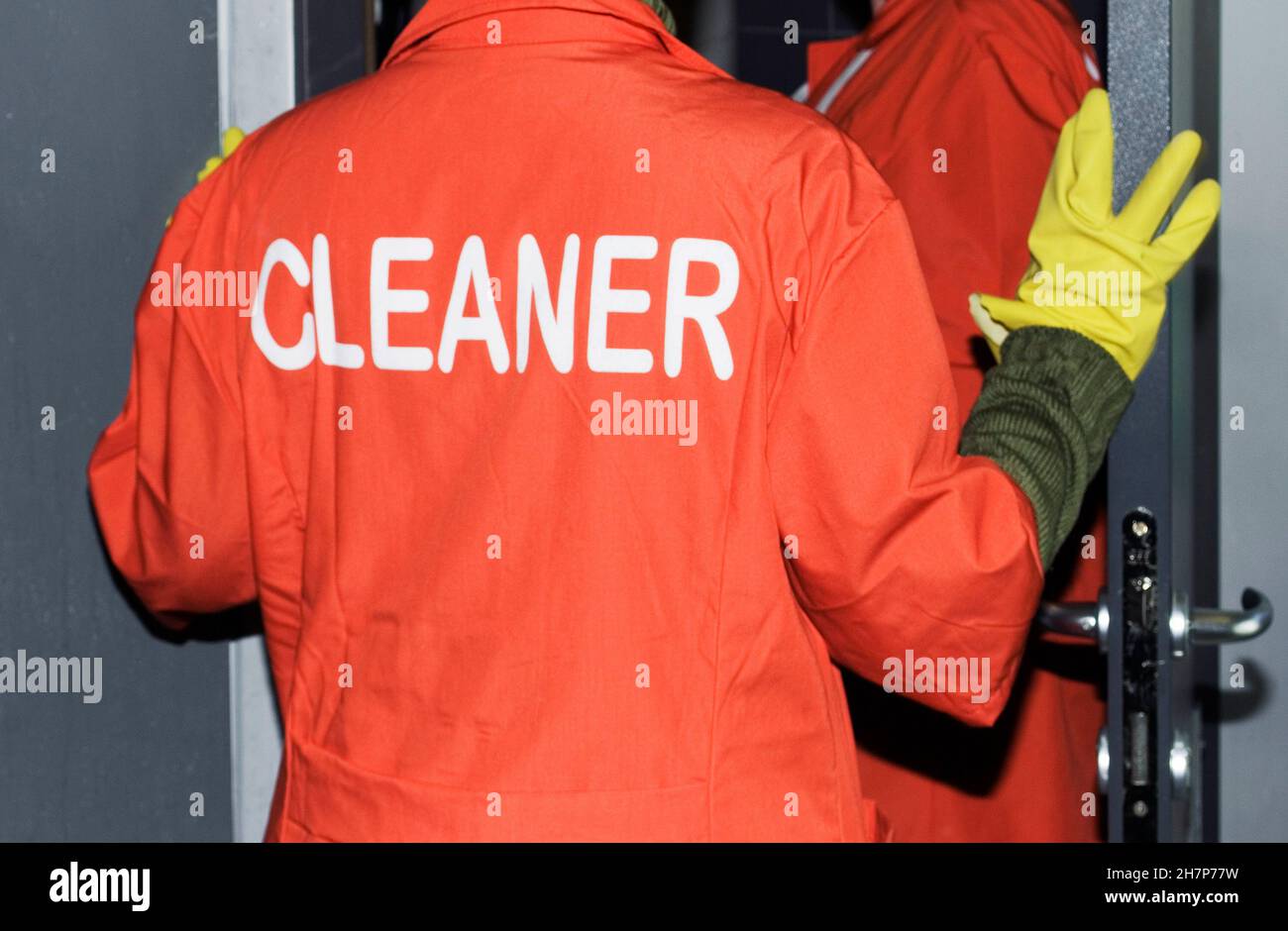 pulitori con uniforme arancione Foto Stock