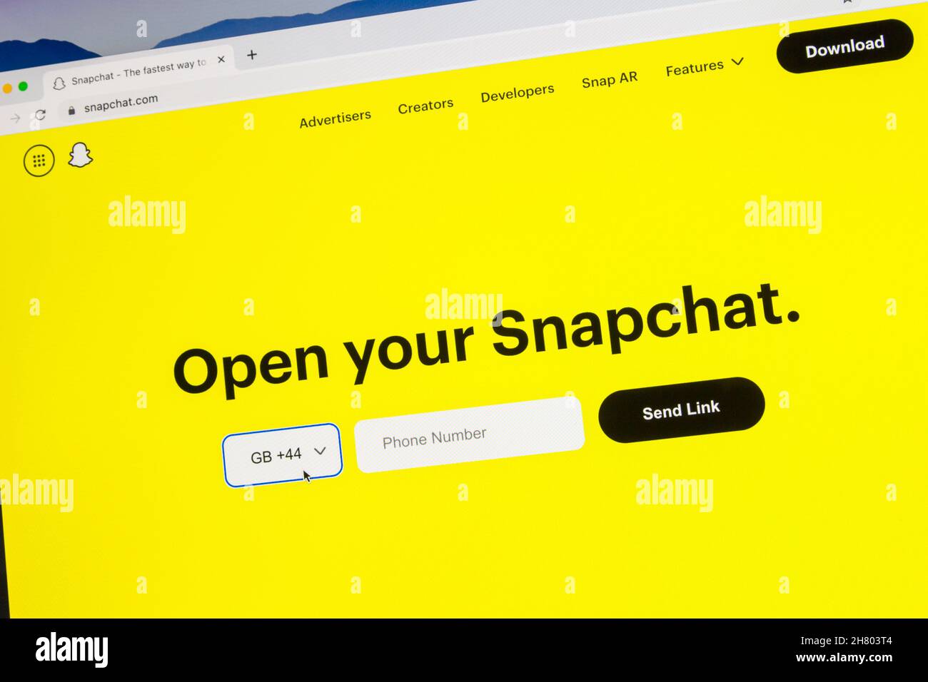 Pagina iniziale del sito di Snapchat con Apri il tuo Snapchat e il numero di telefono degli Stati Uniti Foto Stock