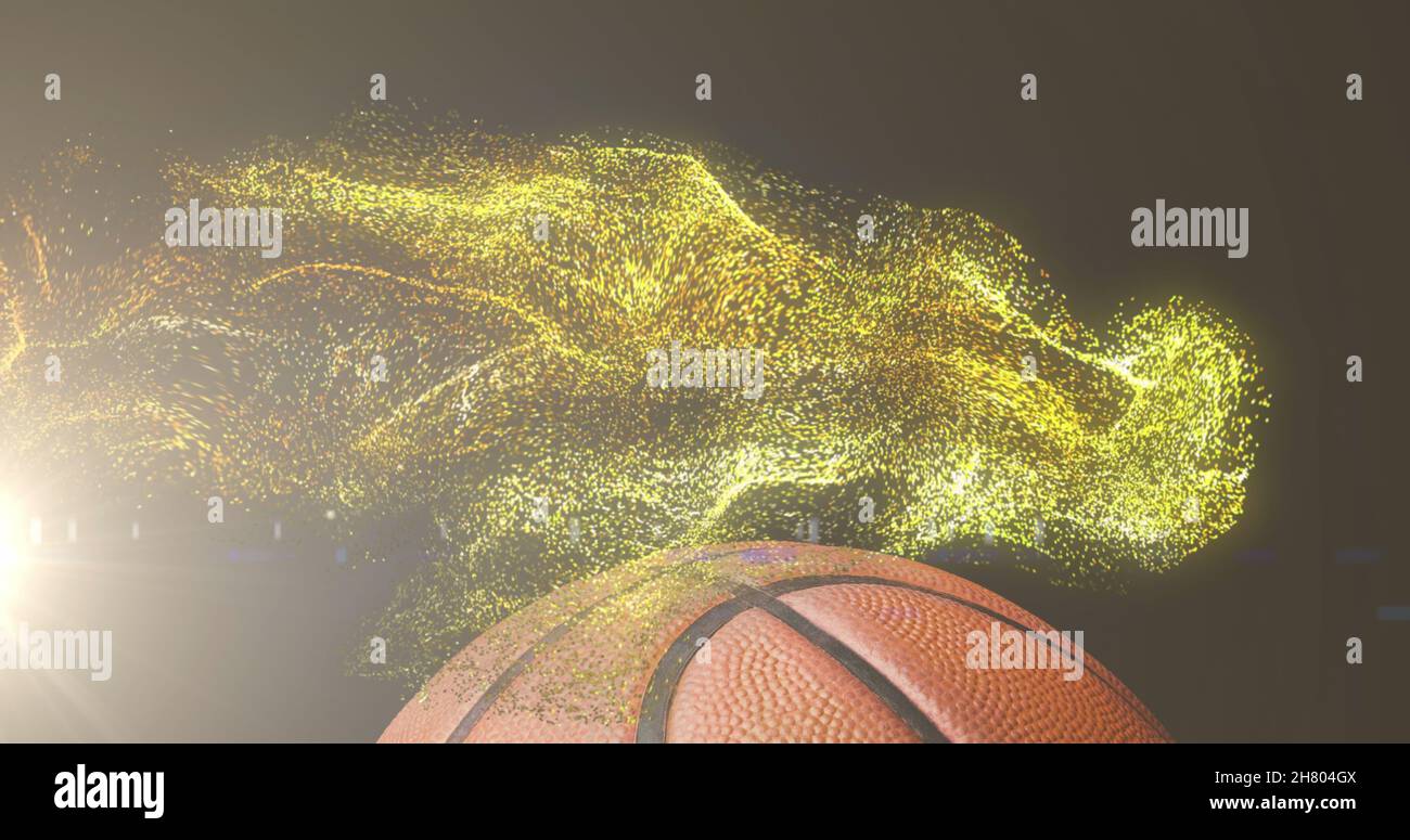 Immagine di particelle d'oro incandescenti che si muovono sul basket Foto Stock