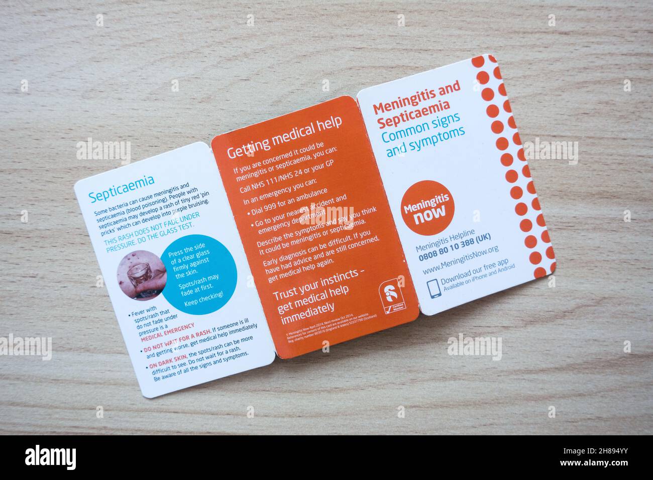 Meningite ora carta tascabile di carità per identificare i sintomi della meningite presto Foto Stock