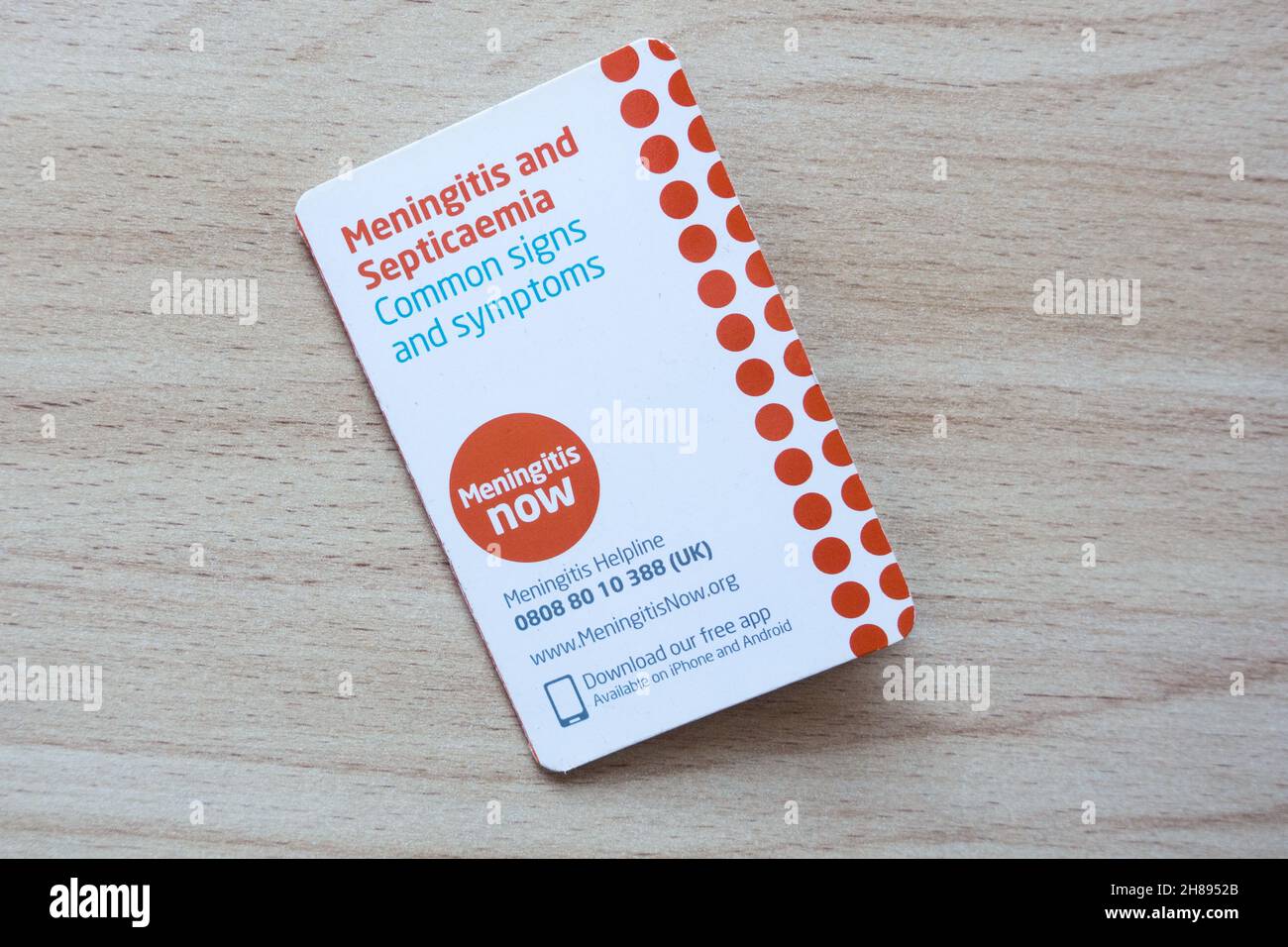 Meningite ora carta tascabile di carità per identificare i sintomi della meningite presto Foto Stock