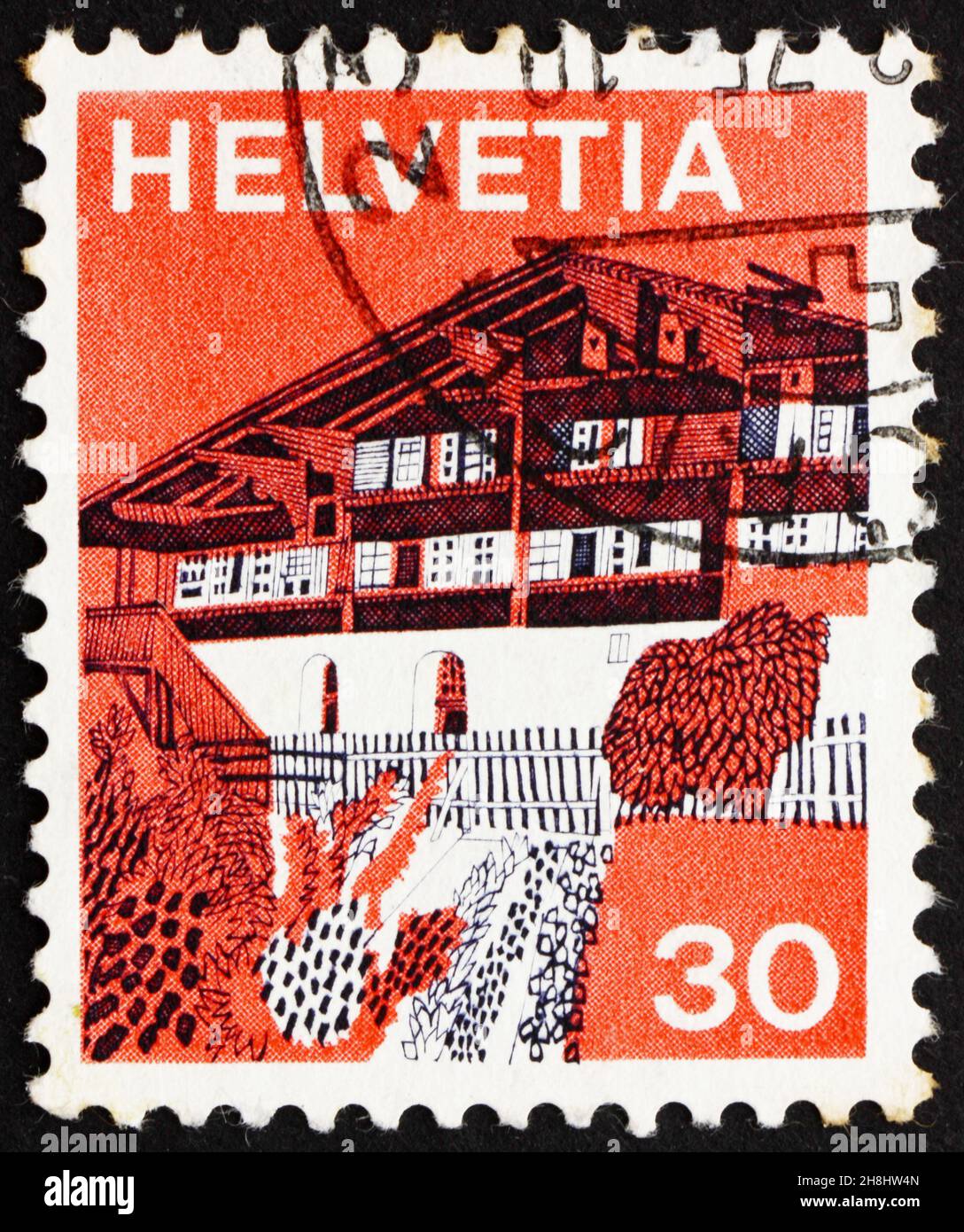 SVIZZERA - CIRCA 1973: Un francobollo stampato in Svizzera mostra Village in Simme Valley, Svizzera, circa 1973 Foto Stock