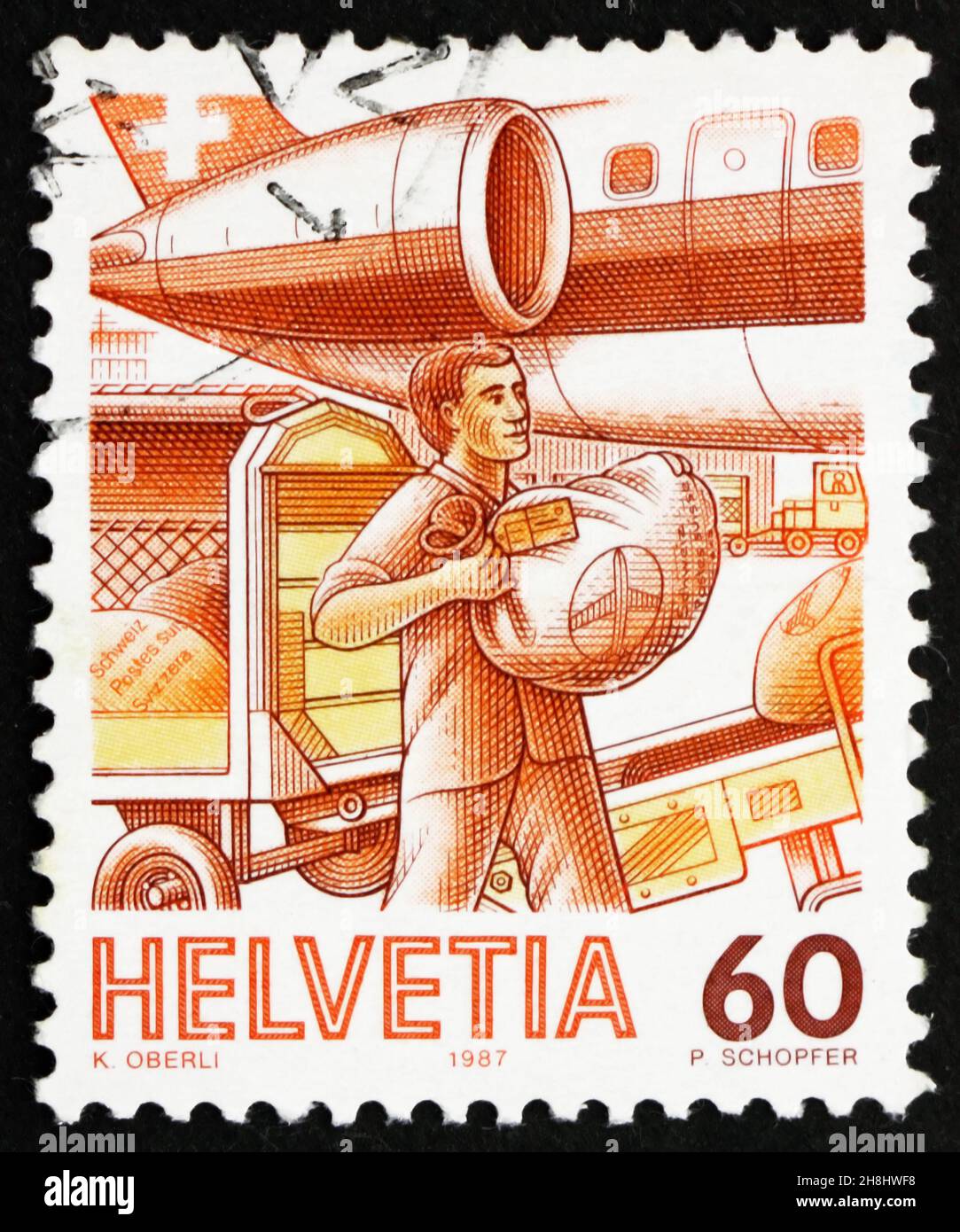 SVIZZERA - CIRCA 1987: Un francobollo stampato in Svizzera mostra Loading AirMail, Mail Handling, circa 1987 Foto Stock