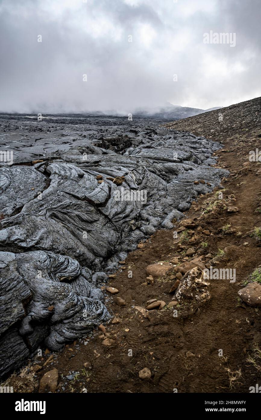Campo di lava, flusso di lava e lava, Fagradersfjall, sistema vulcanico di Krysuvik, Penisola di Reykjanes, Islanda Foto Stock